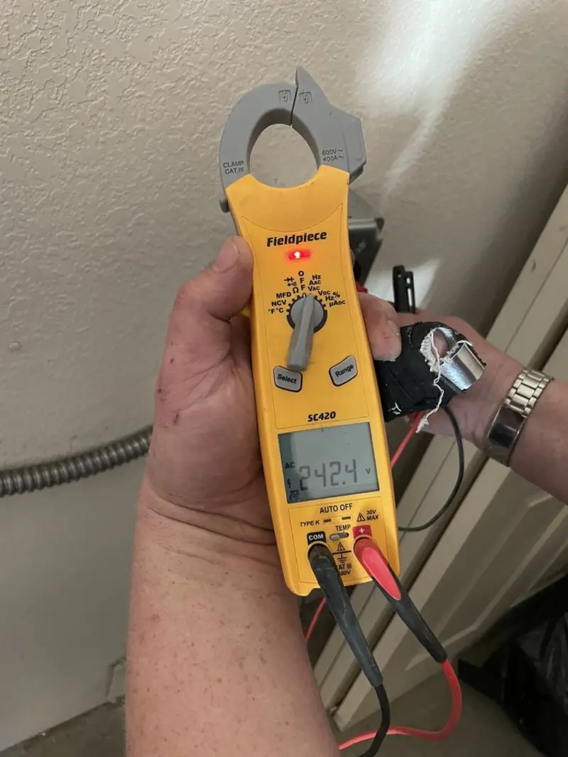 Voltage testing with clamp meter during Generator Installation in Shady Hollow